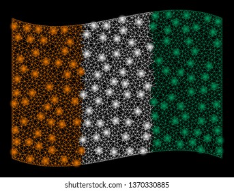Waving Ivory Coast Flag mesh illustration with glow effect. Vector flying official Ivory Coast Flag designed with polygonal network, illuminated nodes, small circle.
