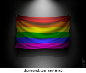 waving Rainbow flag of LGBT community with illuminated