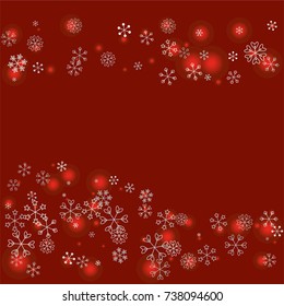 Wavy Christmas background with random scatter falling silver snowflakes and red blurred lights on a burgundy background.