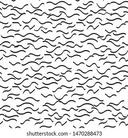 Wavy lines hand drawn seamless vector pattern. Ink brush texture. Black curly waves on white background. Paint brushstrokes grunge freehand drawing. Abstract textile, wrapping paper monochrome design.