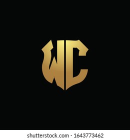 Monograma del logotipo WC con colores dorados y plantilla de diseño de forma de escudo