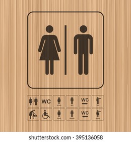 WC - Toilet Door/wall Plate. Original WC Icons Set On Wooden Background. The Washroom Signs Set.