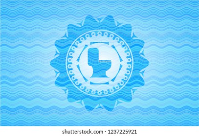WC toilet icon inside sky blue water wave style badge.