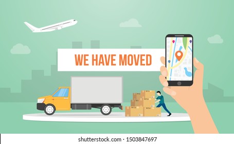 we have moved text banner title with hand holding smartphone and truck with modern flat style - vector
