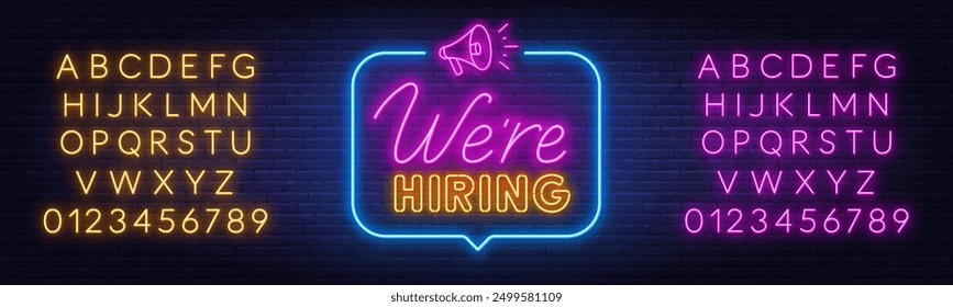 We Hiring neon sign in speech bubble on brick wall background.