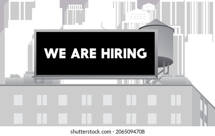 We are hiring text on a billboard sign atop a brick building. Outdoor advertising in the city. Large banner on roof top of a brick architecture. Business, Job opportunity concept.