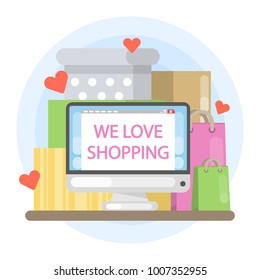 We love shopping. Computer screen with shopping bags.