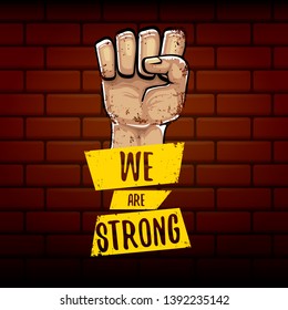 We are strong concept illustration with rised fist in the air isolated on brick wall background. Motivational slogan