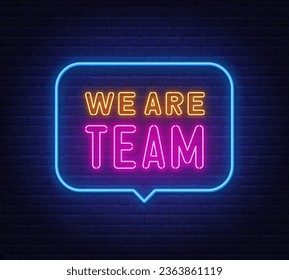 We Are Team neon sign in the speech bubble on brick wall background.