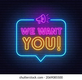 We want you neon sign in the speech bubble on brick wall background.