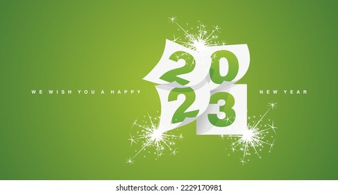 We wish you a Happy New Year 2023 greeting card design template with light sparkle firework on lucky green background. New Year 2023 start concept