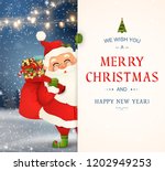 We Wish you a Merry Christmas. Happy new year. Santa Claus character with big signboard. Merry Santa Clause with gift bag full of gift boxes. Holiday greeting card with Christmas snow. Isolated vector