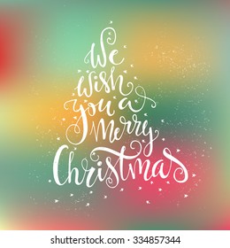 We wish you a merry Christmas - quote in a shape of a christmas tree.- unique handdrawn typography poster.  Great vector design element for congratulation cards, banners and flyers. 
