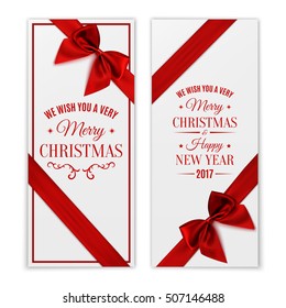 We Wish You Merry Christmas and Happy New Year 2017. Two white greeting card templates with red ribbon and a bow isolated on white background. Vector illustration.