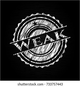Weak chalkboard emblem on black board