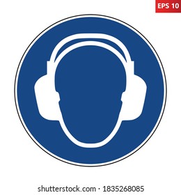 Wear ear protection sign. Vector illustration of circular blue sign with human head wearing headphones icon inside. Hearing protection symbol isolated on white background. Caution noise.