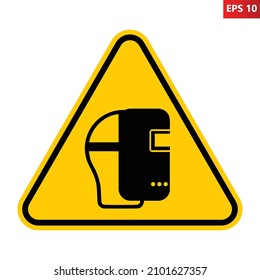 Wear welding mask sign. Vector illustration of yellow triangle warning sign with human head wearing welding mask icon inside. Protective face shield symbol. Caution. Personal protection safety concept