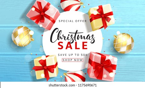 Web banner for Christmas sale. Elegant background with top view on realistic gift boxes and Christmas balls on rustic wooden texture. Vector illustration with confetti and effect bokeh.