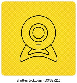 Web cam icon. Video camera sign. Online communication symbol. Linear icon on orange background. Vector