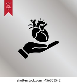 Web icon. Human heart in hand