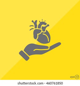 Web icon. Human heart in hand