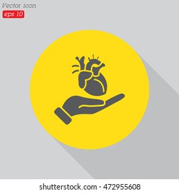 Web icon. Human heart in hand