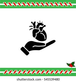 Web icon. Human heart in hand