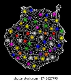 Web mesh vector map of Gran Canaria with flare effect on a black background. Abstract lines, light spots and spheric points form map of Gran Canaria constellation.
