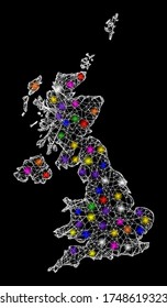 Web mesh vector map of United Kingdom with glare effect on a black background. Abstract lines, light spots and small circles form map of United Kingdom constellation.