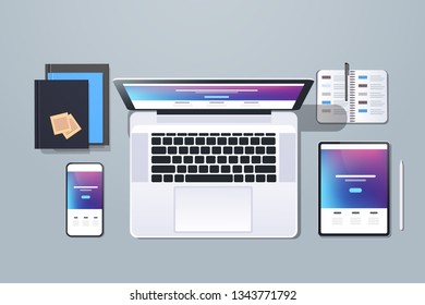 web technology network concept top angle view desktop laptop smartphone tablet screen networking office stuff horizontal
