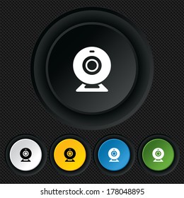 Webcam sign icon. Web video chat symbol. Camera chat. Round colourful buttons on black texture. Vector