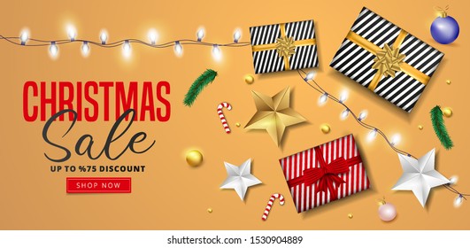 Website header or banner design decorated with pine tree leaves, garland, golden stars, baubles and 75% discount offer for Christmas Sale.