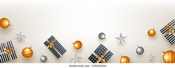 Website header or banner design, top view of gift boxes, stars and baubles on shiny background with space for your text.
