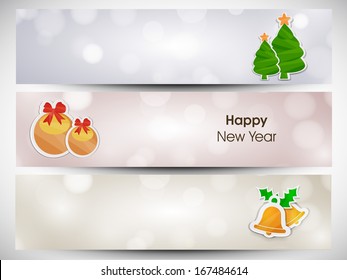  Website header or banner set design for Happy New Year 2014 celebration with Xmas tree, golden Xmas ball and jingle bells. 