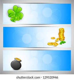 Website header or banner set for St. Patrick's Day celebration with shamrock leaves, gold coins and pot.
