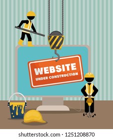 website under construction with desktop computer