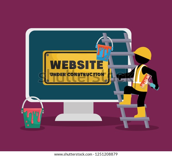 website under construction with desktop computer