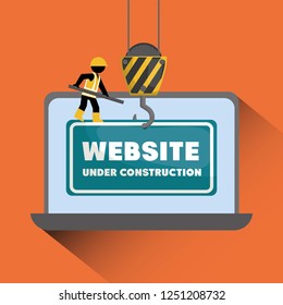 website under construction with laptop