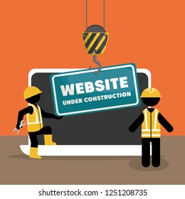 website under construction with laptop