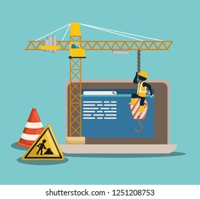 website under construction with laptop