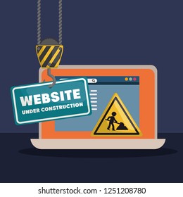 website under construction with laptop