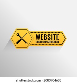 Website under construction sign with white background.