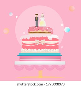 Wedding cake decorated with bride and groom dolls.