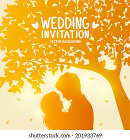 wedding card with romantic silhouette of loving couple at sunset under tree