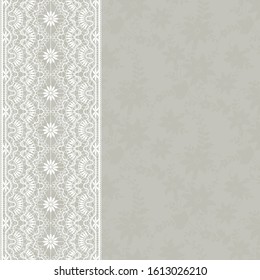 Wedding card with white lace border on a gray background