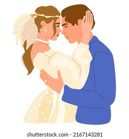 Wedding couple hugging and looking at each other eyes. Man and woman in love. Bride and groom in wedding costumes.