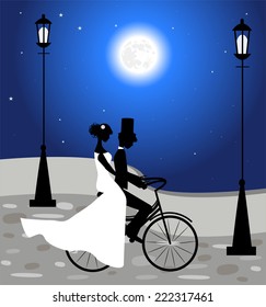 Wedding couple ride a bicycle and full moon