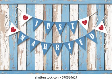 Wedding invitation card. Wedding decorative flags with inscription Just Married. Vintage wooden background. Sea style