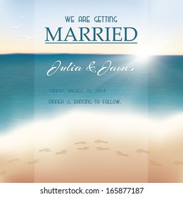 Wedding invitation card. View of the sea with footprints in the sand.