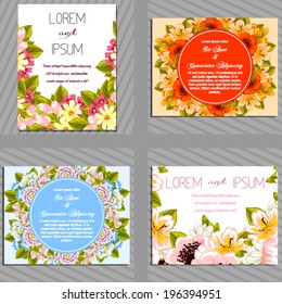 Wedding invitation cards with floral elements.